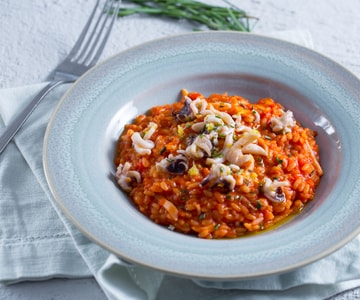 Risotto mit Tintenfischen und Tomaten