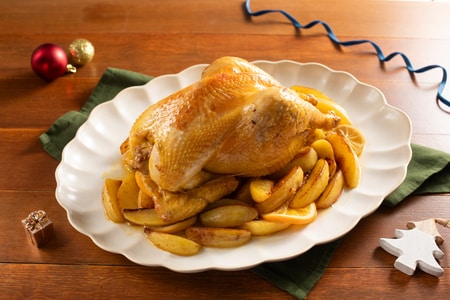 Kapaun mit Zitrusfrüchten