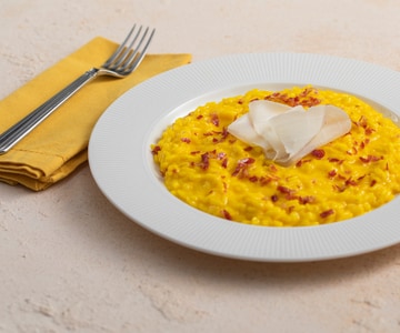 Risotto mit Safran, Taleggio und Speck