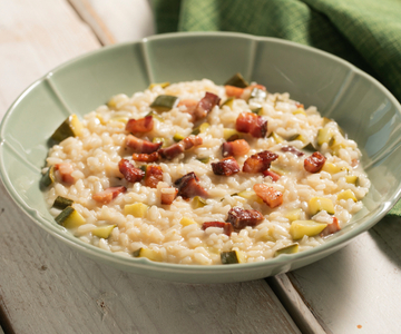 Cremiges Risotto mit Zucchini und Pancetta