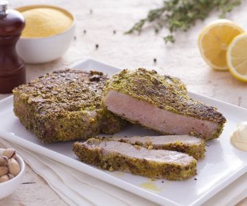 Koteletts mit Zitronenkruste und knuspriger Panade